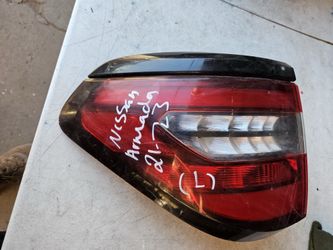 Nissan armada left tail light Oem