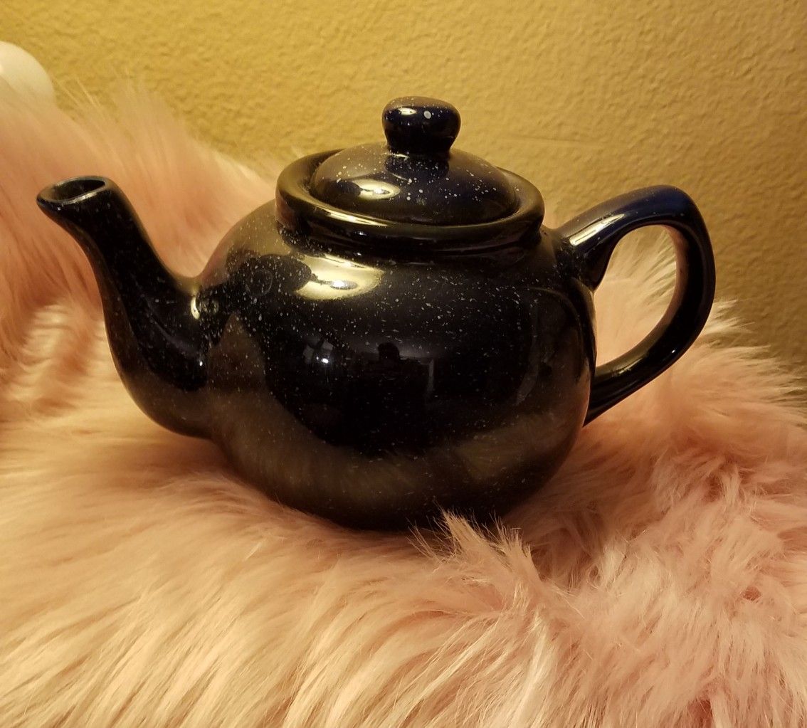 Cute blue ceramic tea pot.