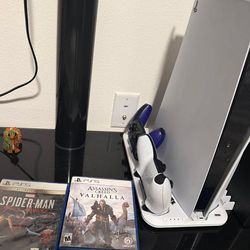 Ps5 2 joysticks 2 games and charger stand.