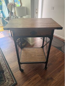 Tall wood table with wheels