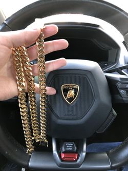 New 14 k yellow gold Cuban link chain and bracelet