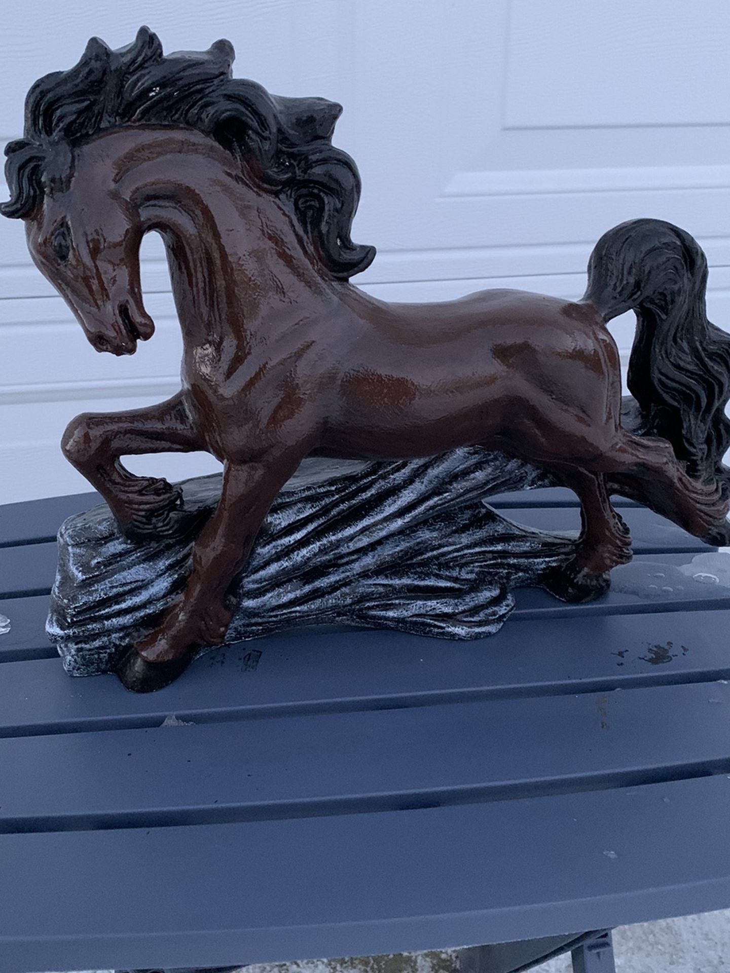 Horse on a log Statue