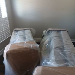 BRAND NEW COUCHES. STILL IN PLASTIC WRAP