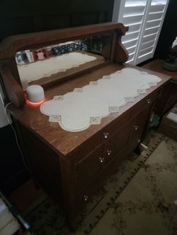 Antique oak buffet with beveled mirror