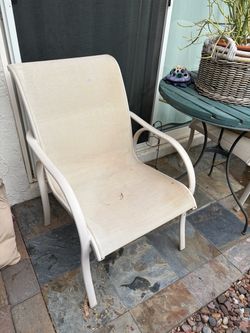 2 meshed patio chairs