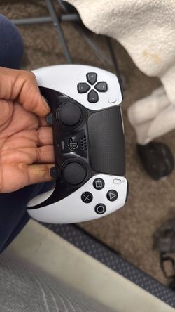 Dual Sense Edge controllers one black white and the other is all black.