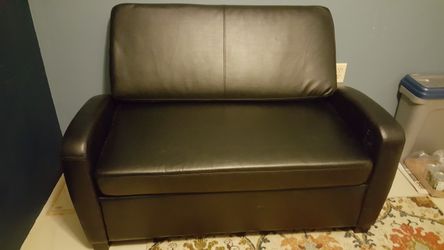 Sofa bed. Twin. Black faux leather. Never slept on mattress still has plastic. Smoke free home. 59x29.