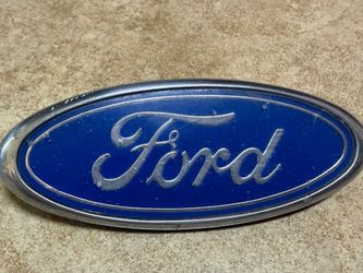 Vintage Ford oval emblem, featuring part numbers F37B-(contact info removed)-AA and E97B-8C020-AA