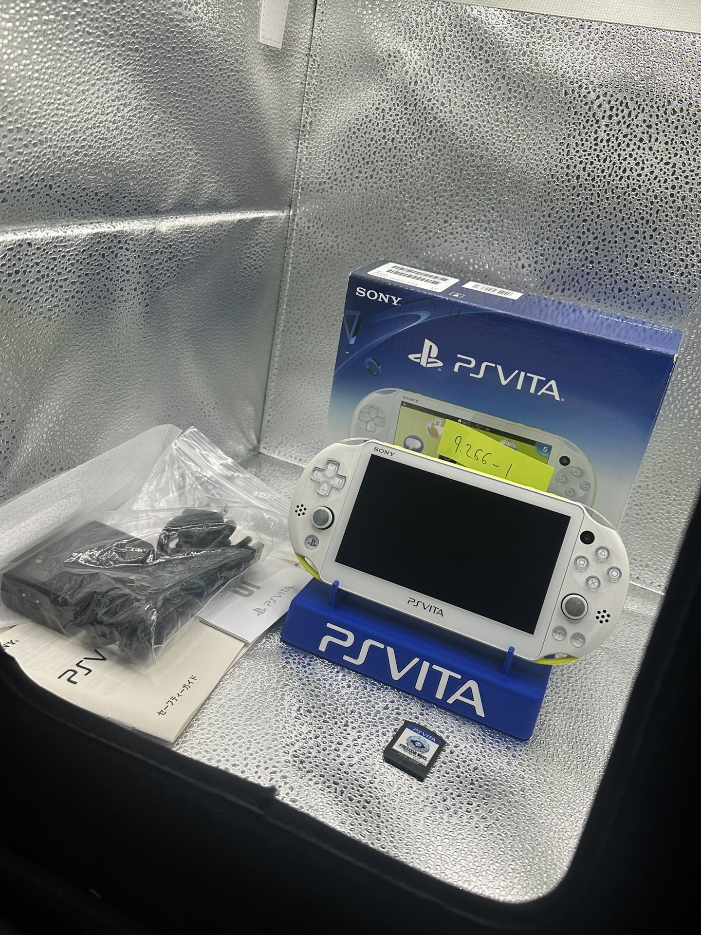 white/yellow ps vita 2000 w/accessories and box!