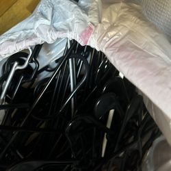 big bag of black plastic hangers 