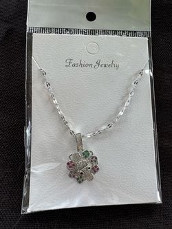 Silver Flower rotating Pendant Necklace with Colored Stones
