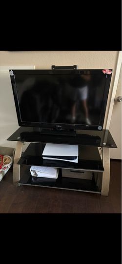 Insignia Flat Screen TV with Glass TV Stand