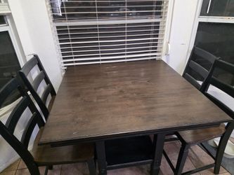 Dark brown/Black Pub table and 4 chairs