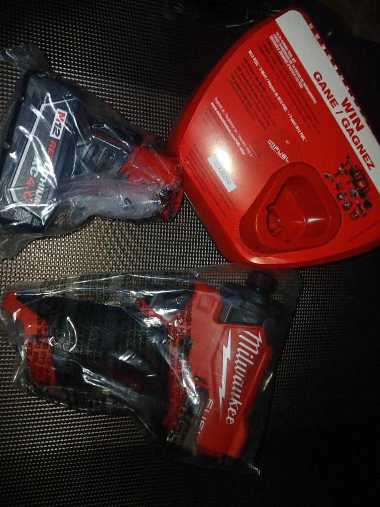 Milwaukee M12 Fuel Impact Driver Charger And Battery