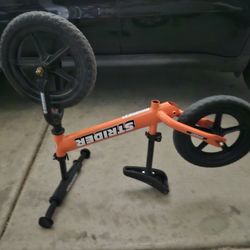 Orange Strider balance bike