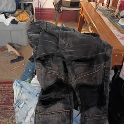 Two Pairs Of Pants One Is Evolution And Black Premium Pants Size 34 The Black One Is 30 32
