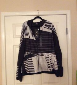 Hyper-reflective Oakley windbreaker