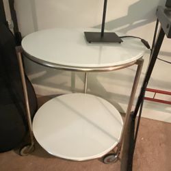 End Table , Round W/ Wheels White Glass Top And Bottom