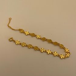 Tory Burch Silver and Gold Cross Bracelets Unisex