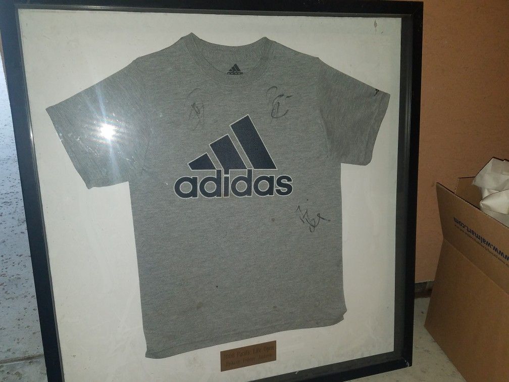 Adidas T-shirt framed and encased signed by tennis stars Djokovic, Federer, and Jankovic unique item perfect for the true fan!