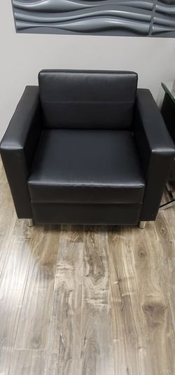 2 reception chairs in black. Like new. $300 each