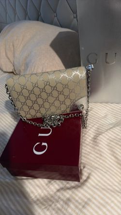 Beige and silver Gucci wallet on a chain
