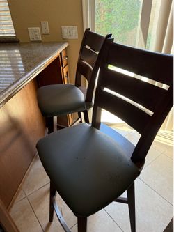 Bar chairs. Brown wood and leather seats