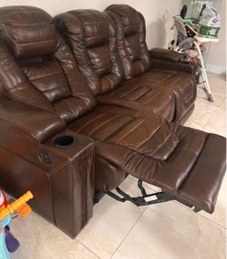 Brown Leather Reclining Loveseat with Cup Holders