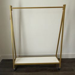 Gold Rolling Garment Rack with Shelf