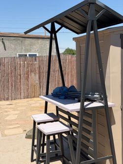 Outdoor bar and stools