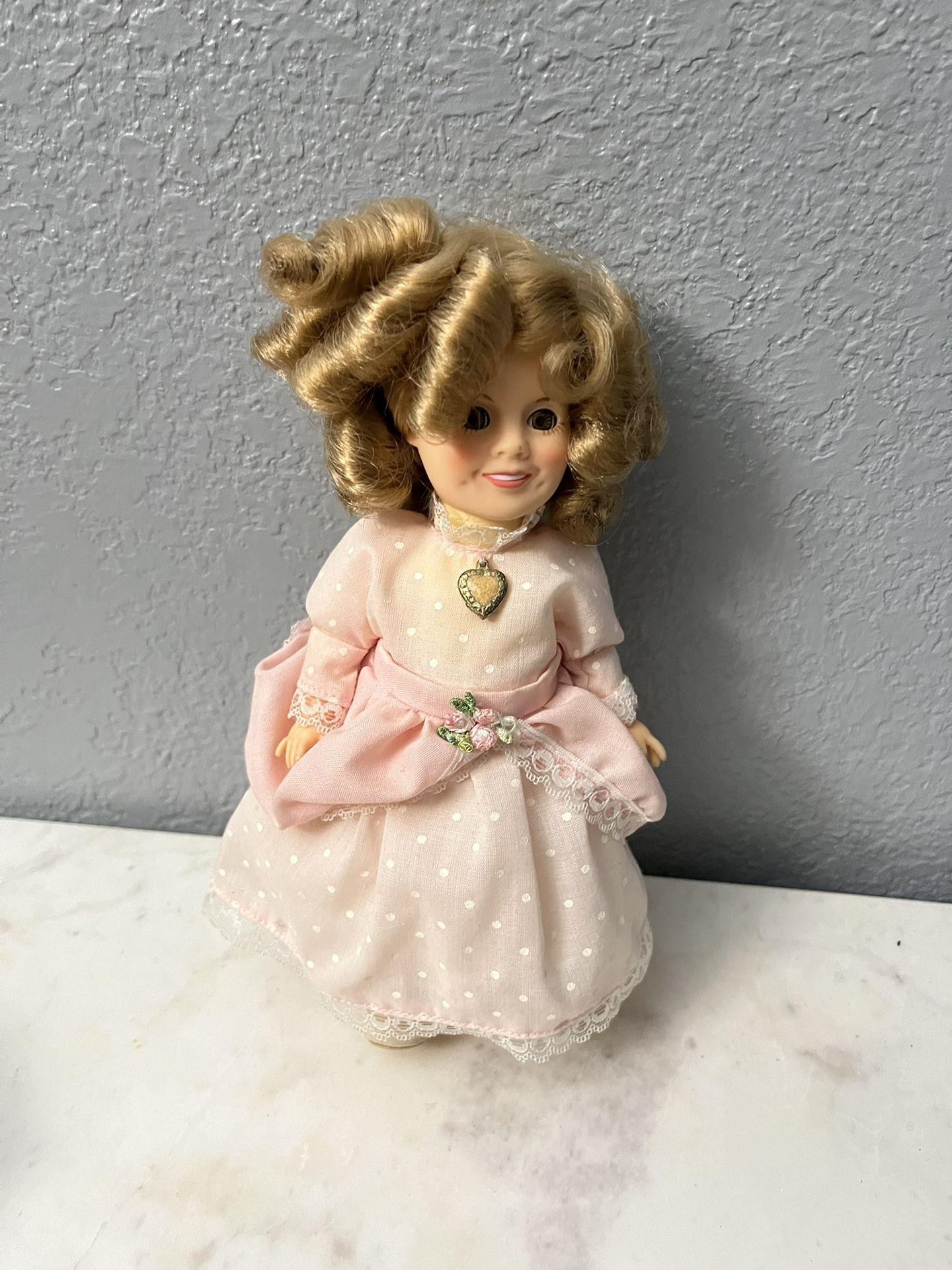 Vintage 1982 IDEAL Shirley Temple Doll. Size appropriately 7 1/2 inches tall. Preowned very good condition.