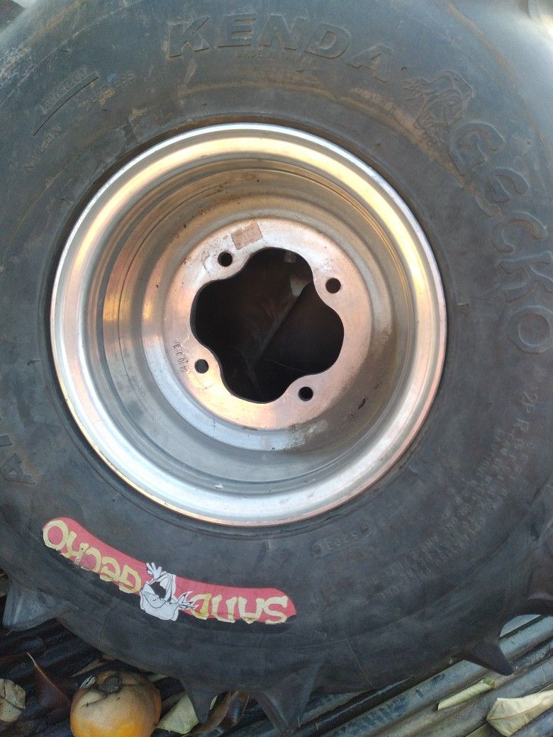 Two Quad Rims And Tires