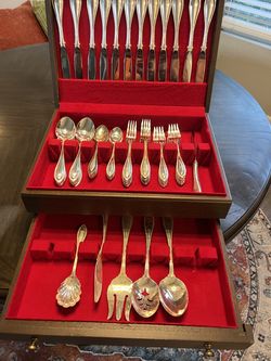 12 Piece silver plated flatware set with serving pieces