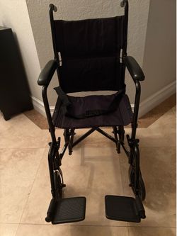 Portable folding wheelchair