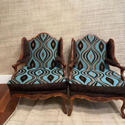 Pair of vintage French Provincial style armchair with a carved wood frame and a modern turquoise and brown velvet upholstery 