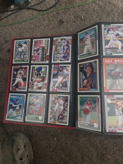 Binder of baseball and football cards.