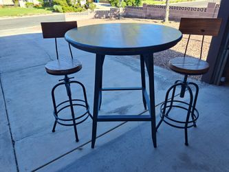 Bar stool table and two chairs.