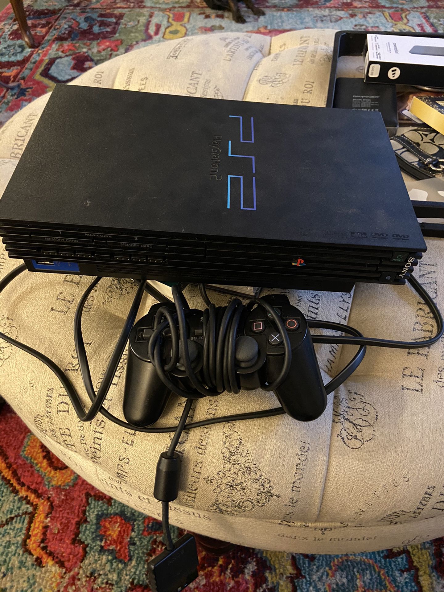 Ps2 with controller and power cord and 7 games