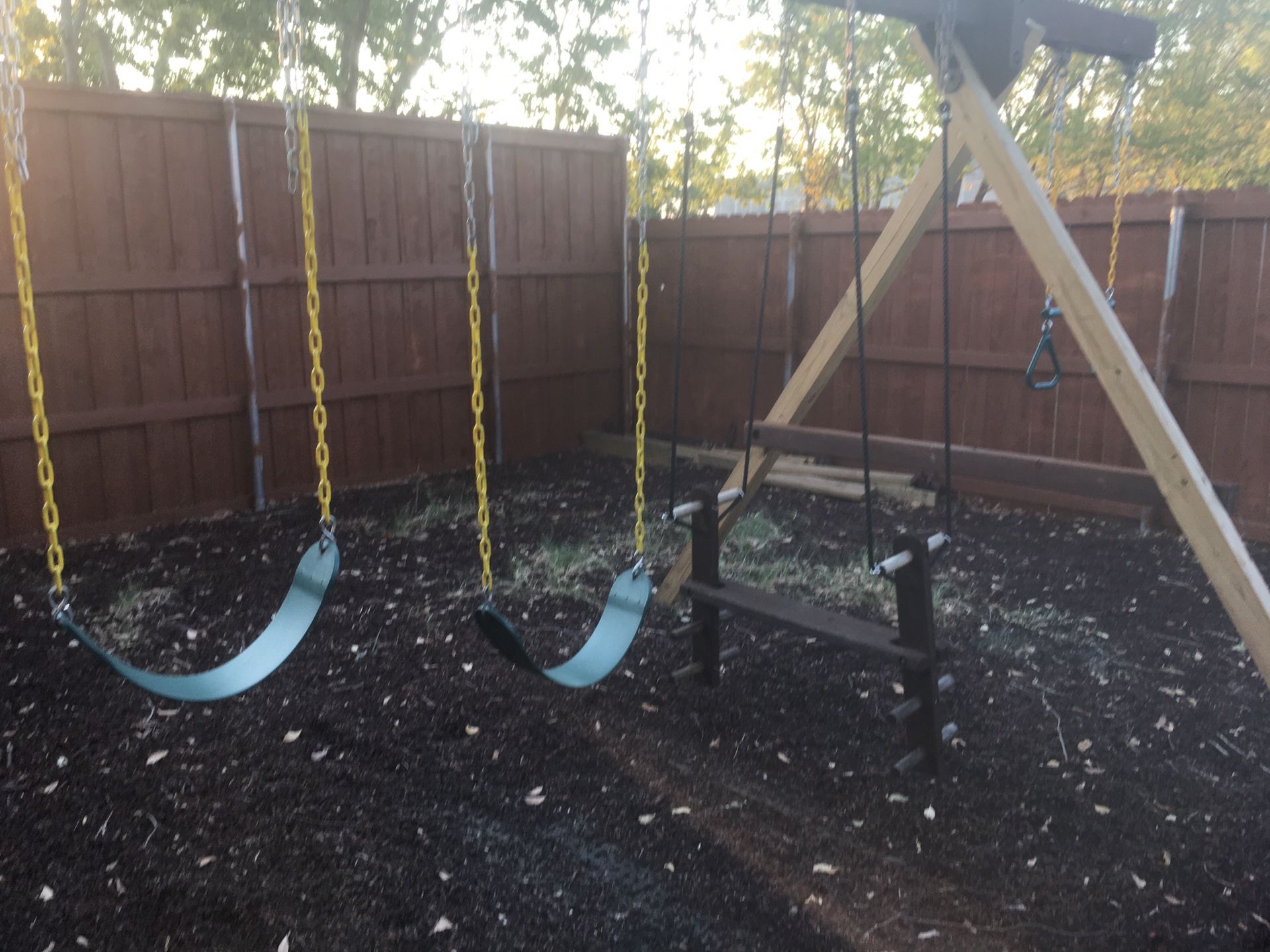 Giant Playground that has a swing set