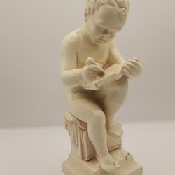 Writing Boy Statue