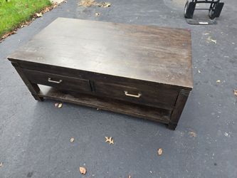 Wooden table with drawers and wheels