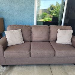 Brown Comfy Couch with 2 additional cushio