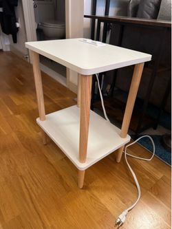 Small white side table with outlet