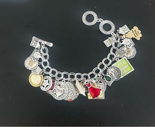 Premier designs bracelet with 26 charms on it