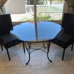 Dining Table with 2 Black Wicker Chairs