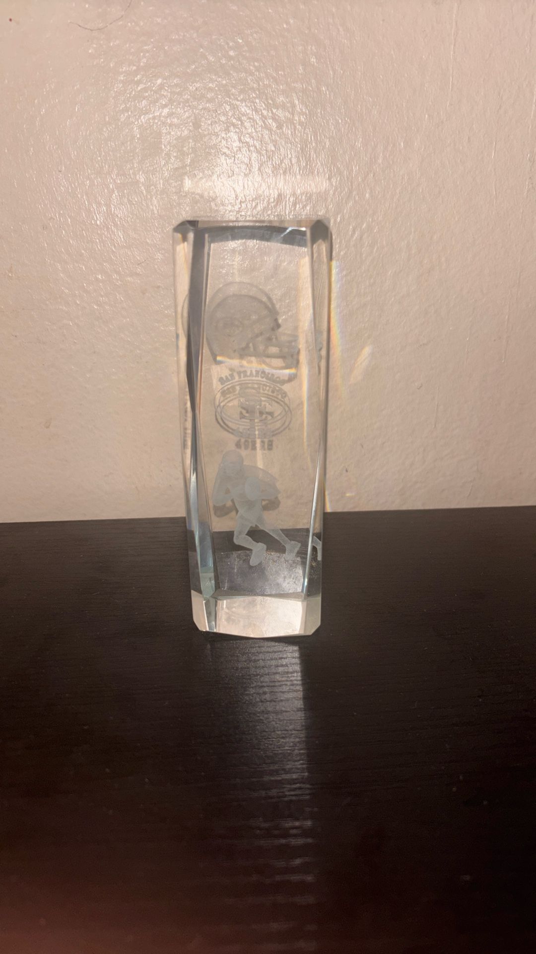 a 3D laser-etched glass paperweight San Francisco 49ers logo and a football player