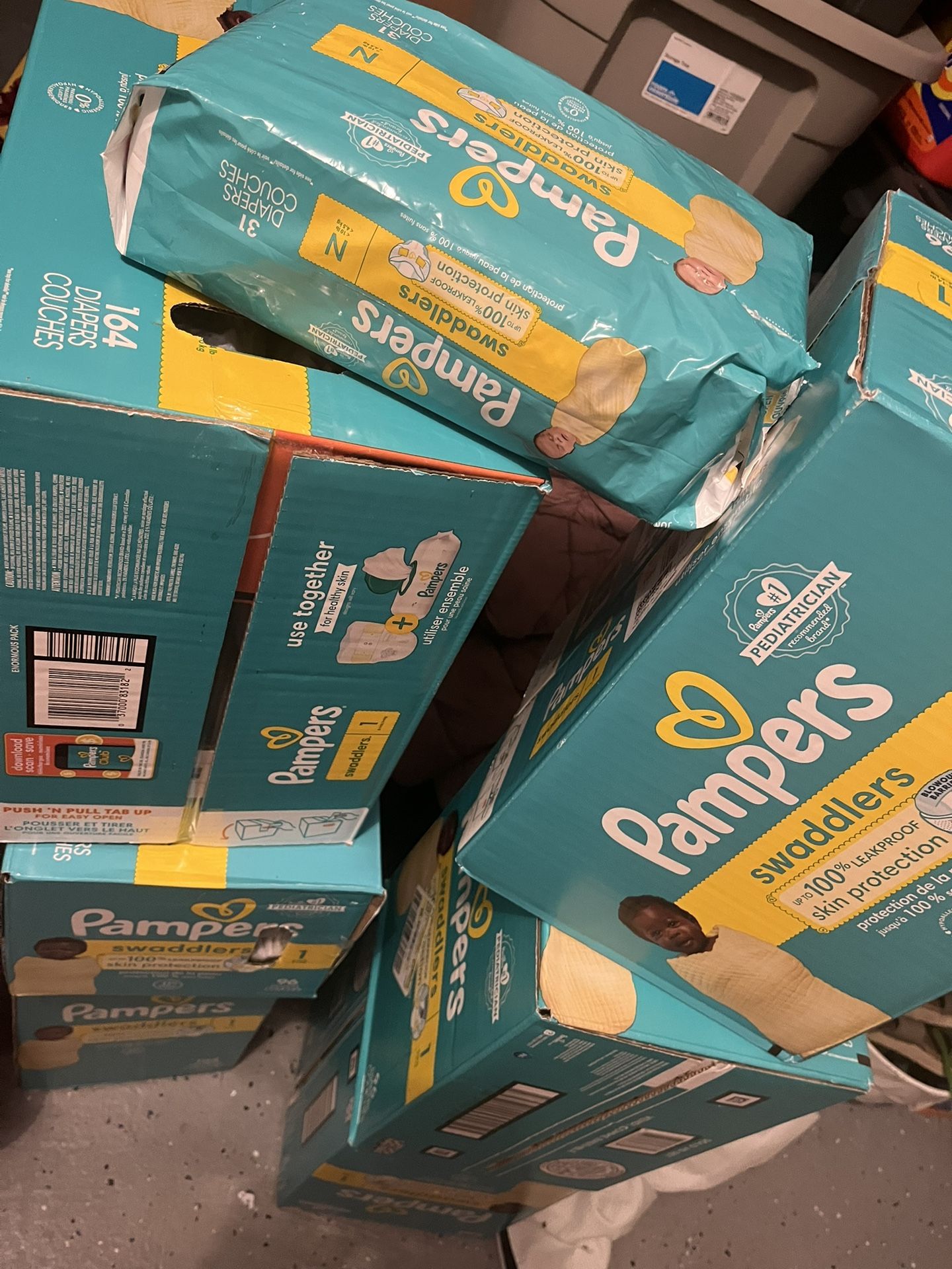 Size 1 Pamper Diapers And One Newborn Pack