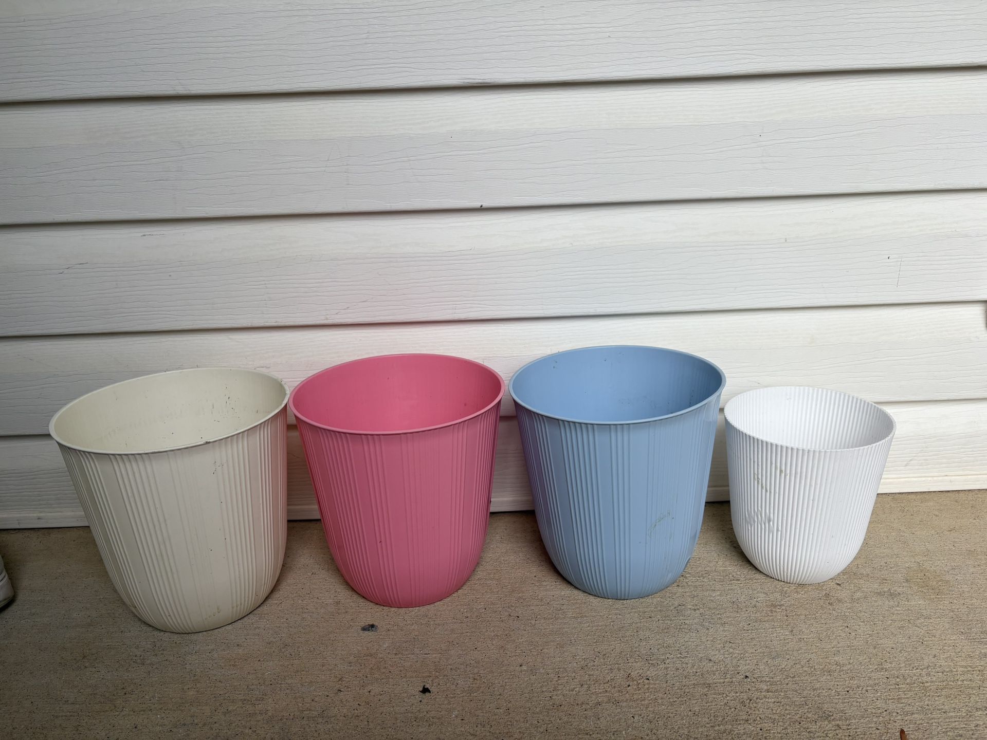 4 Beautiful Plastic Flowers Pots . $40 For All 
