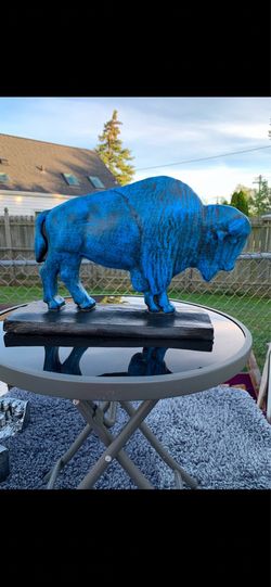 The old blue buffalo statue