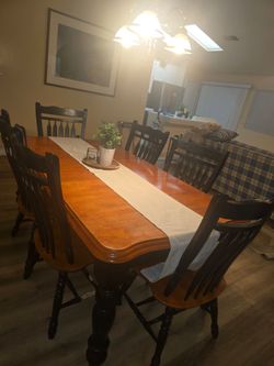 Dining table with 6 chairs. Priced to sell.